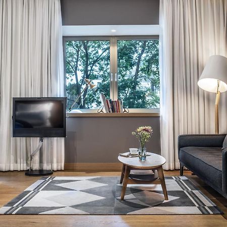 The Guesthouse Wien Eksteriør billede A living room in a serviced apartment in Warsaw, Poland